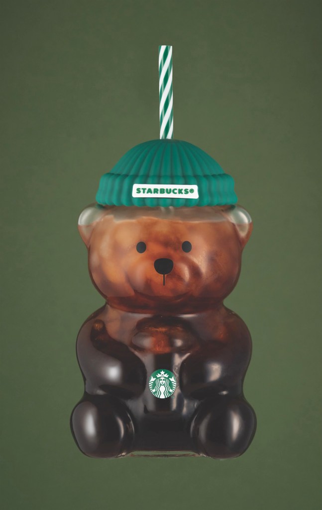 Starbucks Bearista cold cup filled with a dark beverage.