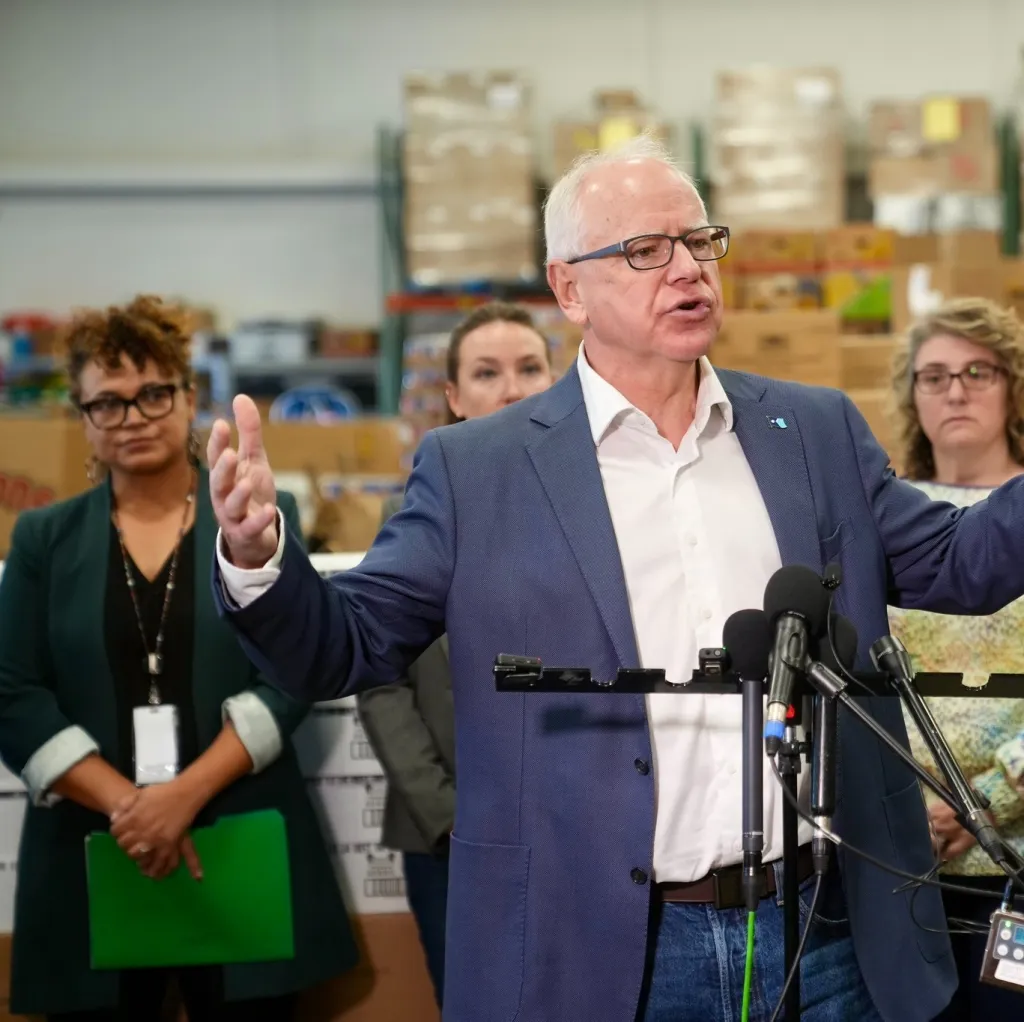 Tikki Brown (Left) with Minnesota Governor Tim Walz.
