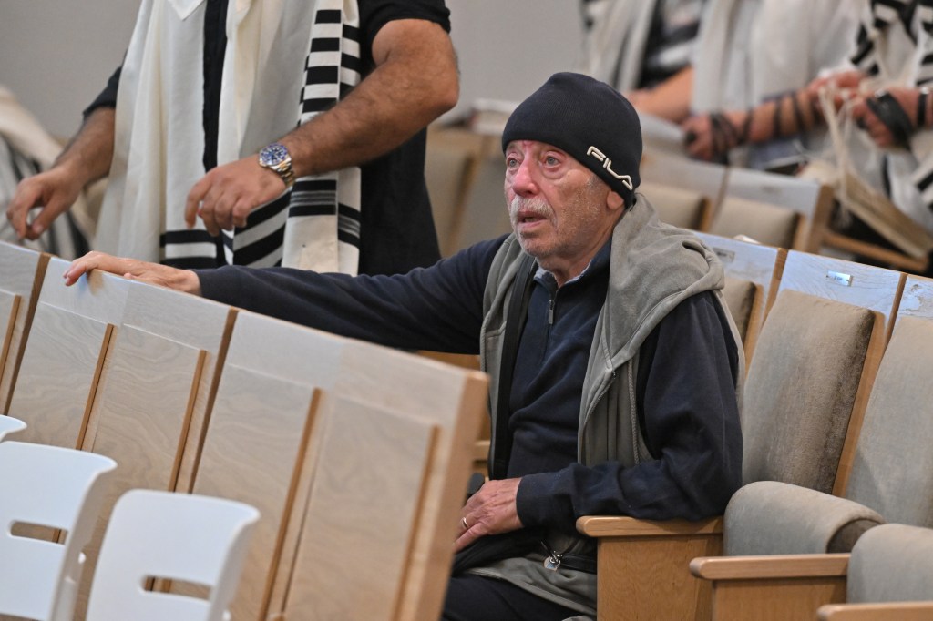 The grandfather of the 10-year-old victim Matilda sits inside the Chabad of Bondi Synagogue before the funeral of Rabbi Eli Schlanger, one of the victims of the Bondi Beach shooting, in Sydney, Australia on December 17, 2025.