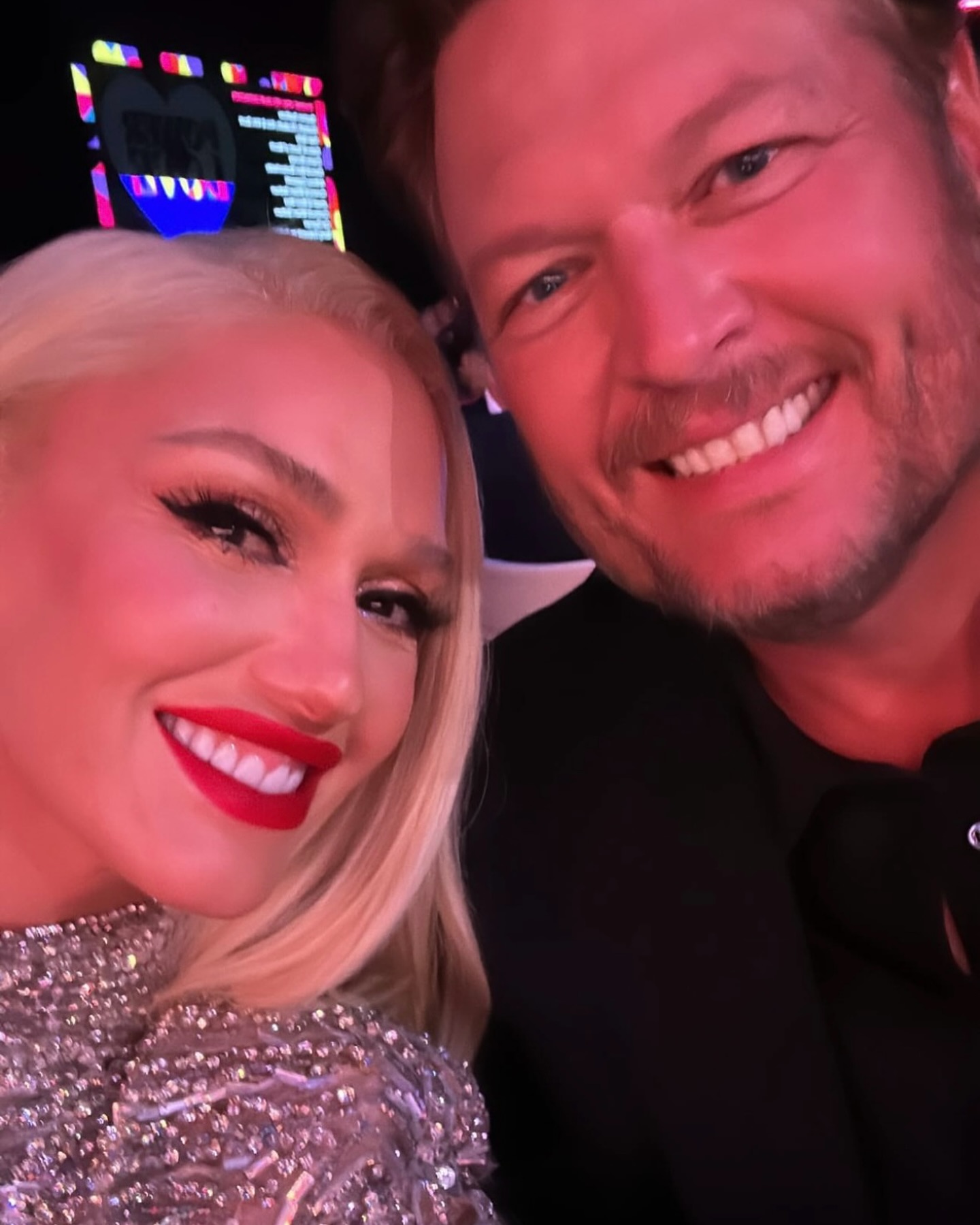 Gwen Stefani and Blake Shelton smiling together.