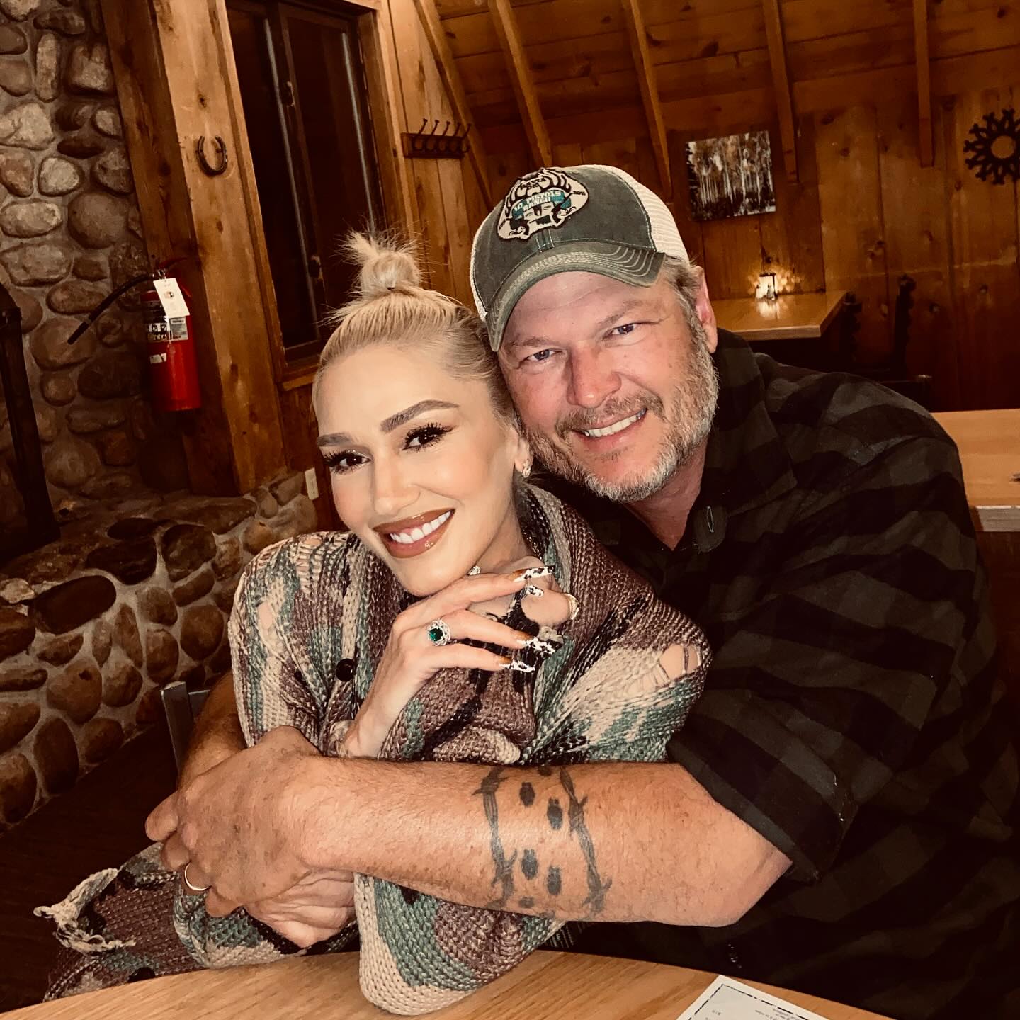 Gwen Stefani and Blake Shelton smiling together.