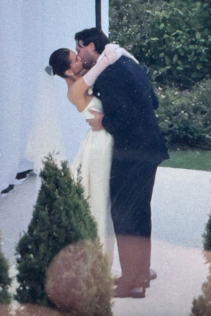 Hailee Steinfeld and Josh Allen share a wedding kiss.