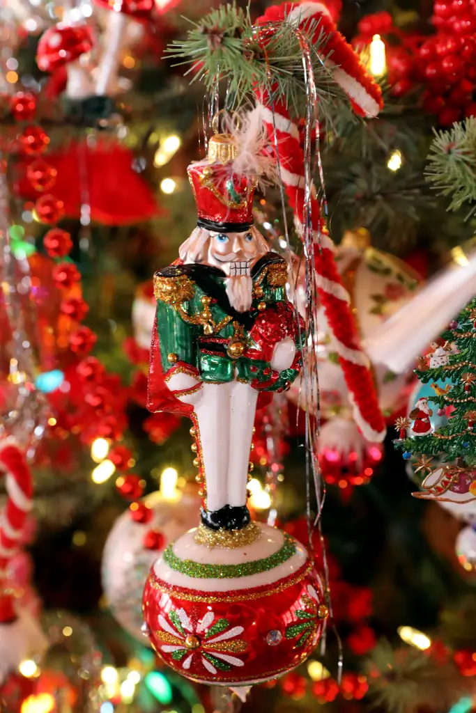 Hampton Court nutcracker ornament designed by Christopher Radko on a Christmas tree.