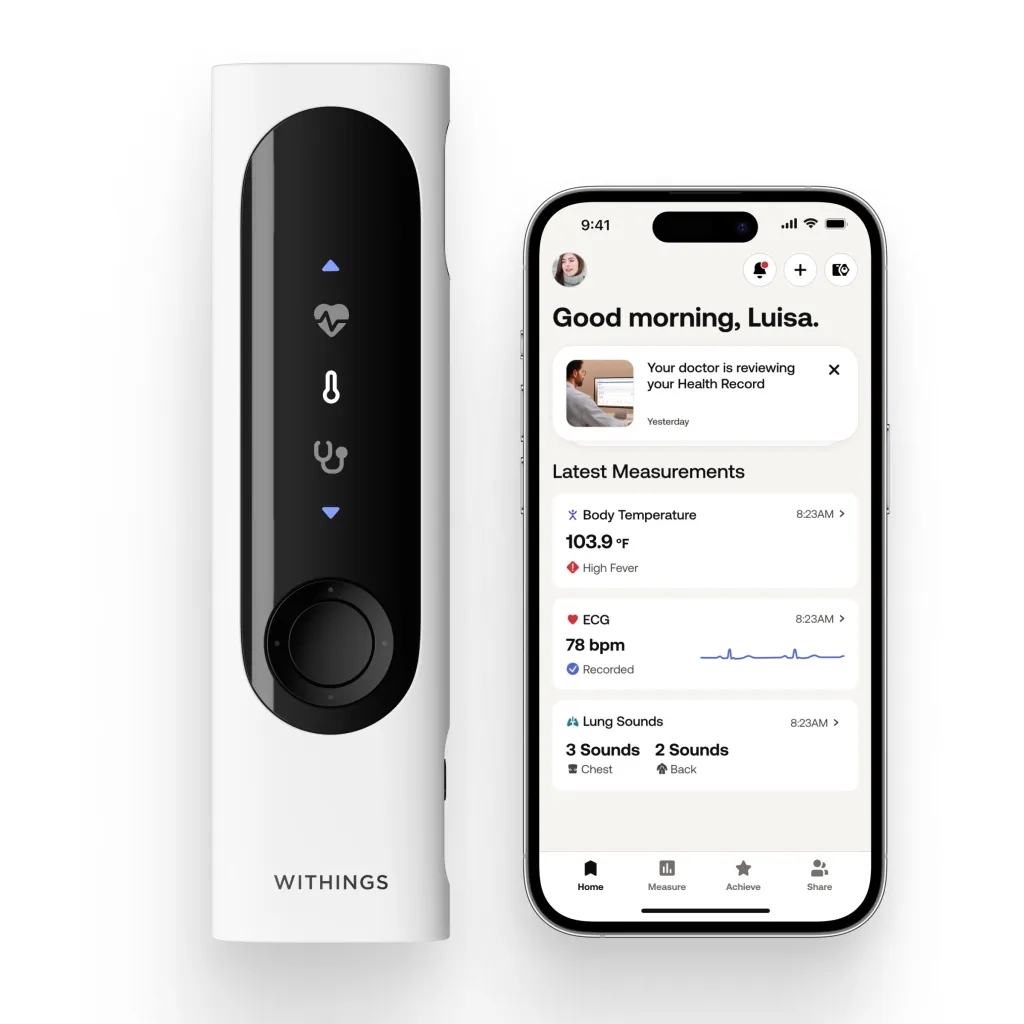 A Withings BeamO thermometer next to a smartphone showing the companion app with health measurements.