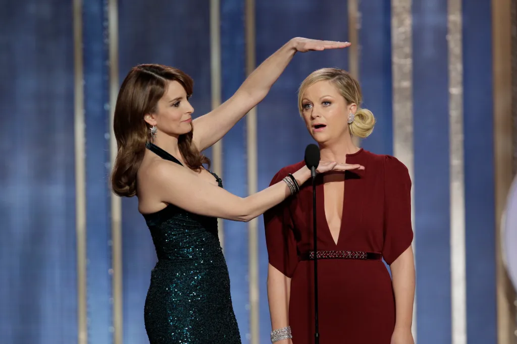 Tina Fey and Amy Poehler host the 70th Annual Golden Globe Awards at the Beverly Hilton Hotel International Ballroom on January 13, 2013 in Beverly Hills, California.