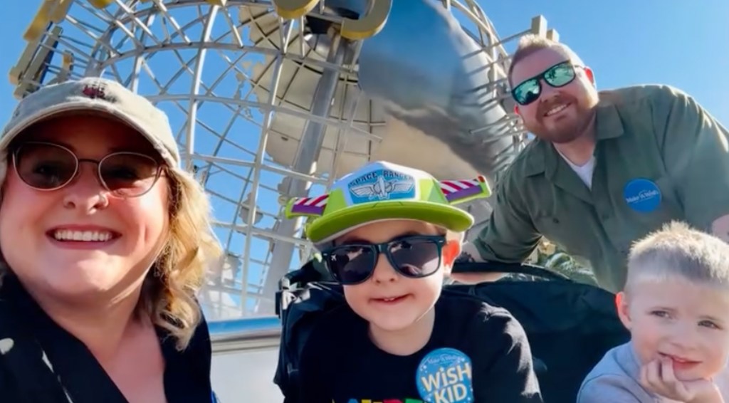 Jada Bafus takes a selfie with her husband and kids at Disneyland