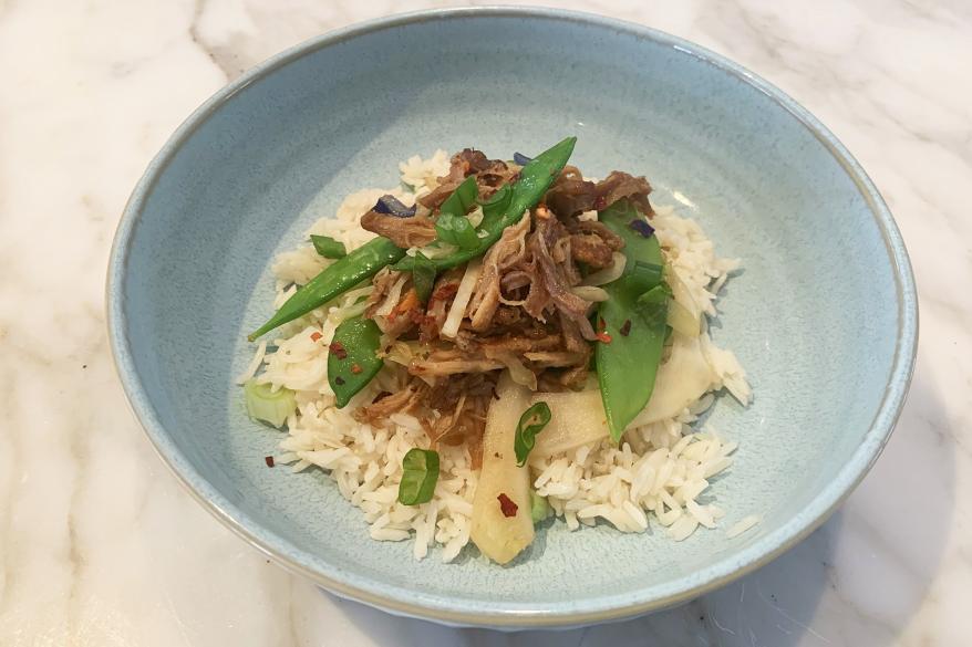 A bowl of food on a marble table