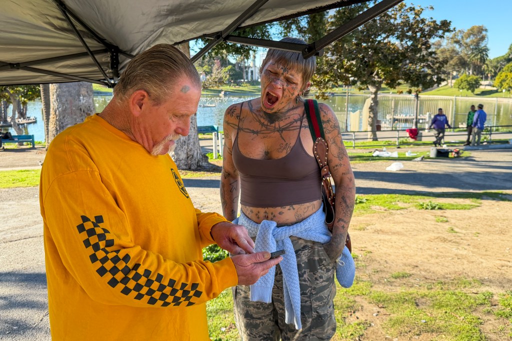 Homeless people resting at MacArthur Park.