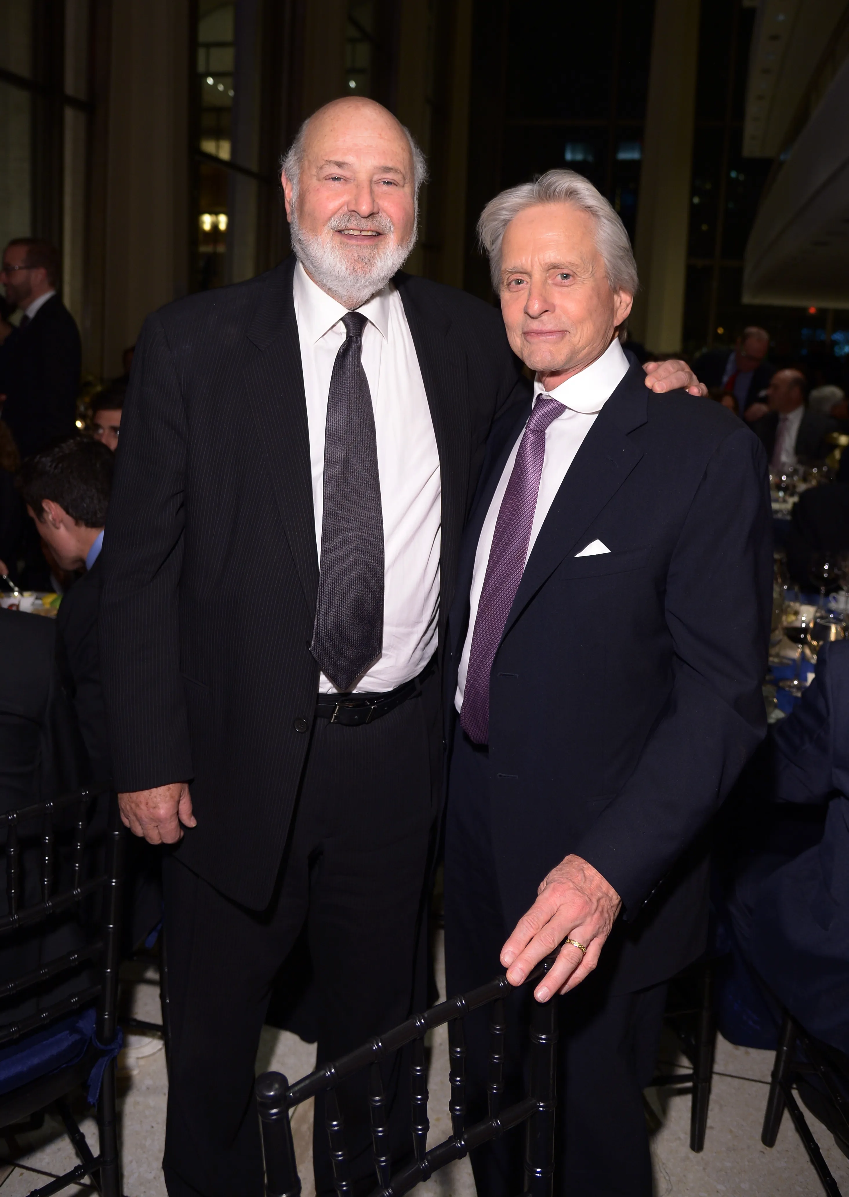 Rob Reiner and Michael Douglas posing together.