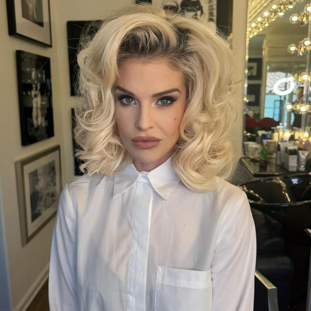 Kelly Osbourne poses for a photo.