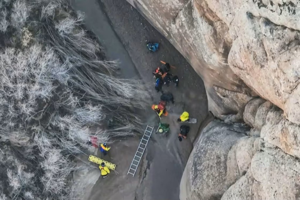 Austin Dirks being rescued from quicksand in a Utah canyon.