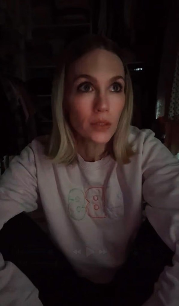 January Jones in a white sweatshirt with 