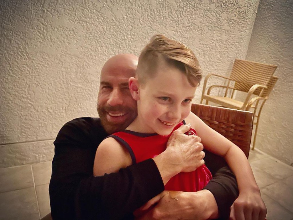 John Travolta embracing his son Ben on his 10th birthday.