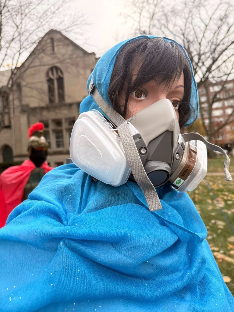 It also shows Mother Mary wearing a respirator mask