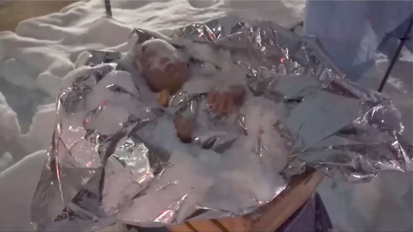 Baby Jesus is wrapped in a thin blanket resembling aluminum foil, which the church said is a reference to the emergency blankets used in detention facilities.