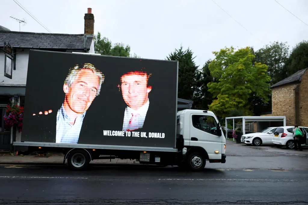 A truck displaying images of Donald Trump and Jeffrey Epstein with the text 
