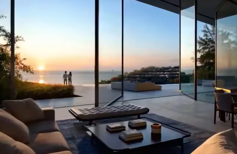 Illustration of a couple watching the sunset over the ocean from a modern house with large glass windows.
