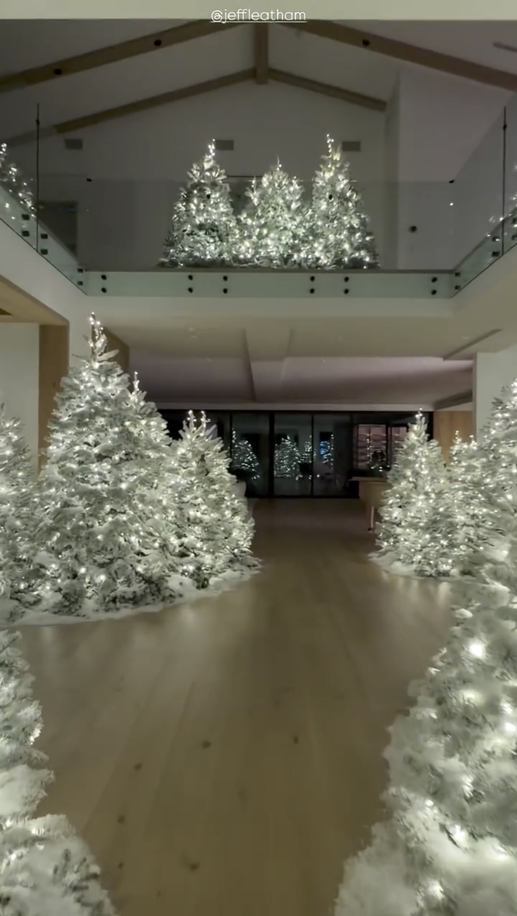 Kim Kardashian's home decorated with multiple lighted Christmas trees.