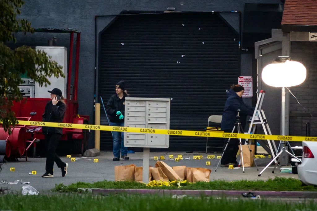 Investigators examine the scene of a mass shooting in Stockton, California.