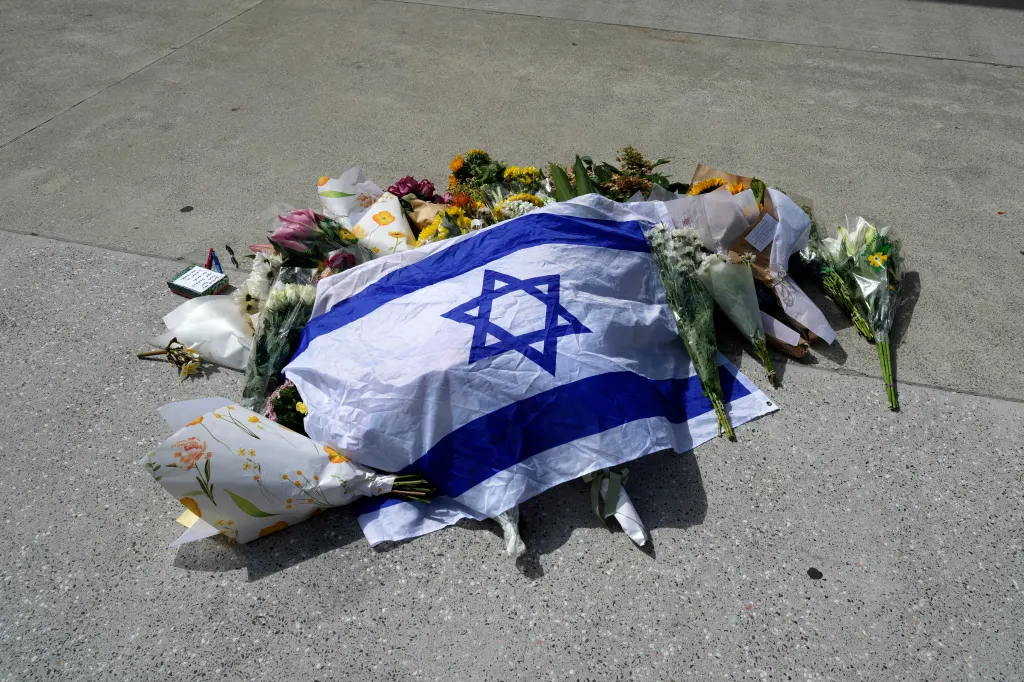 An Israeli flag and flowers at a memorial outside Bondi Pavilion.