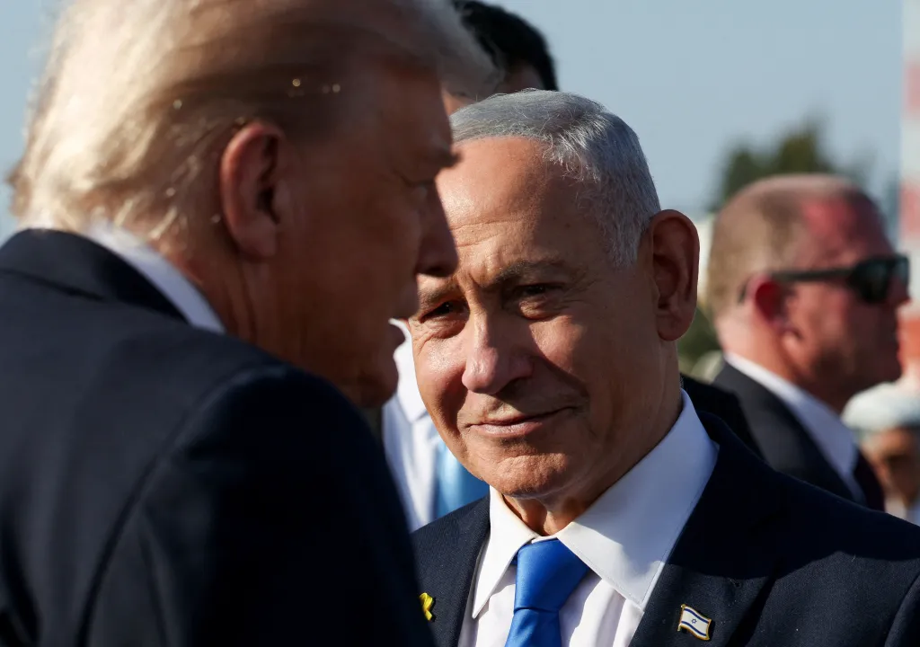 Israeli Prime Minister Benjamin Netanyahu looking at U.S. President Donald Trump before Trump boards Air Force One.
