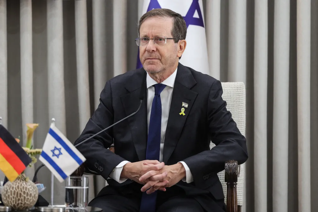 Israel's President Isaac Herzog looks on during a meeting with the German Chancellor.