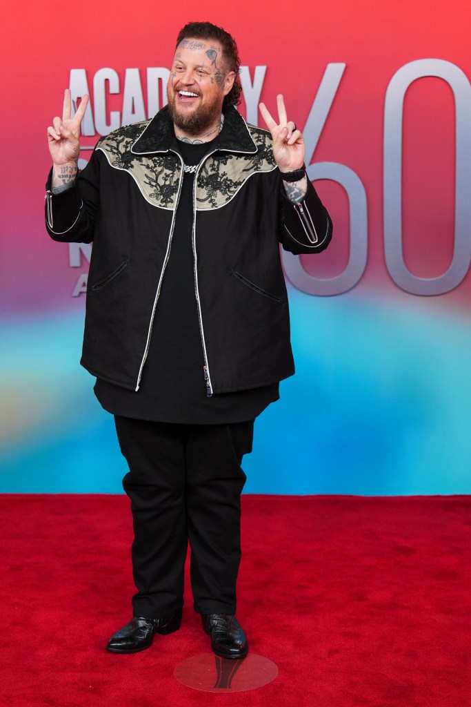 Jelly Roll making a peace sign at the 60th annual Academy of Country Music Awards.