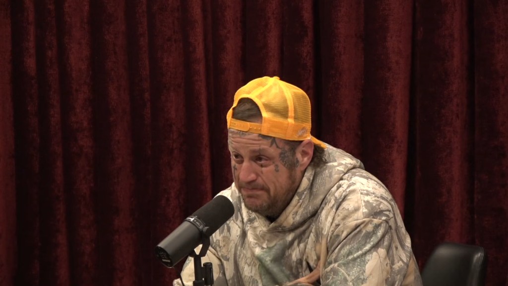 Jelly Roll speaking into a microphone.