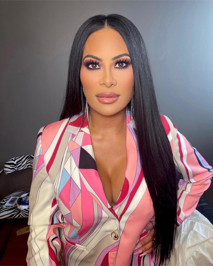 Jen Shah posing for a portrait in a patterned blazer.