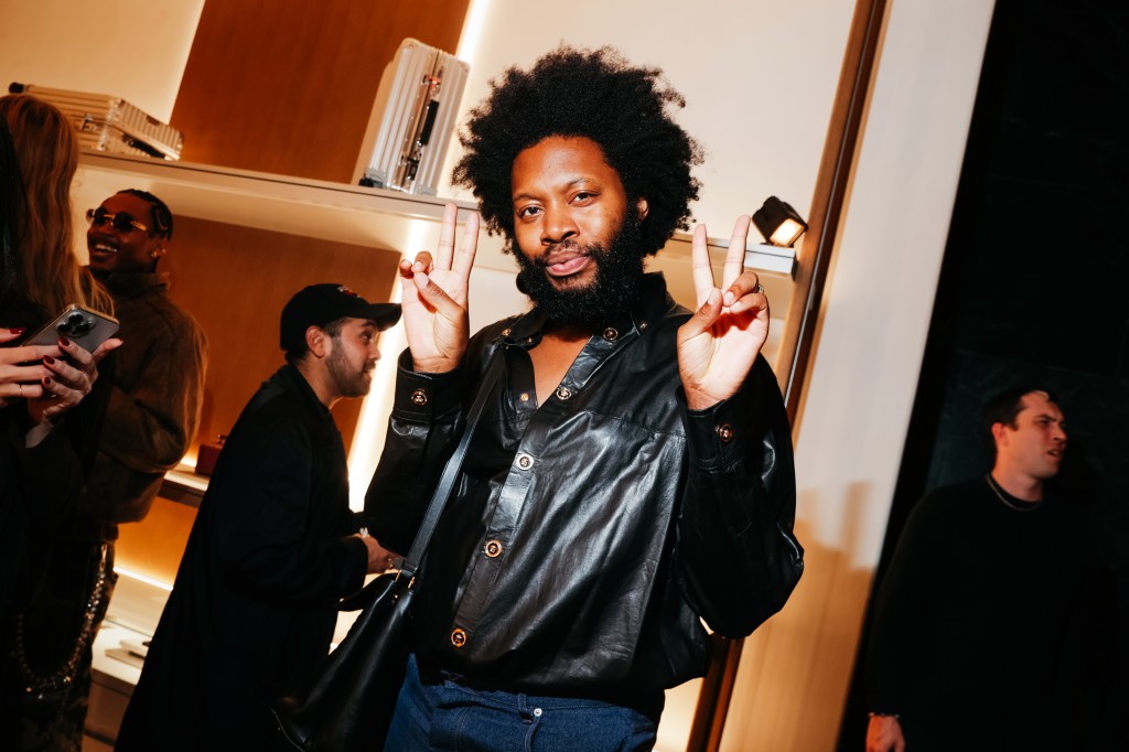 Jeremy O. Harris making peace signs at the Rimowa SoHo Store Party.