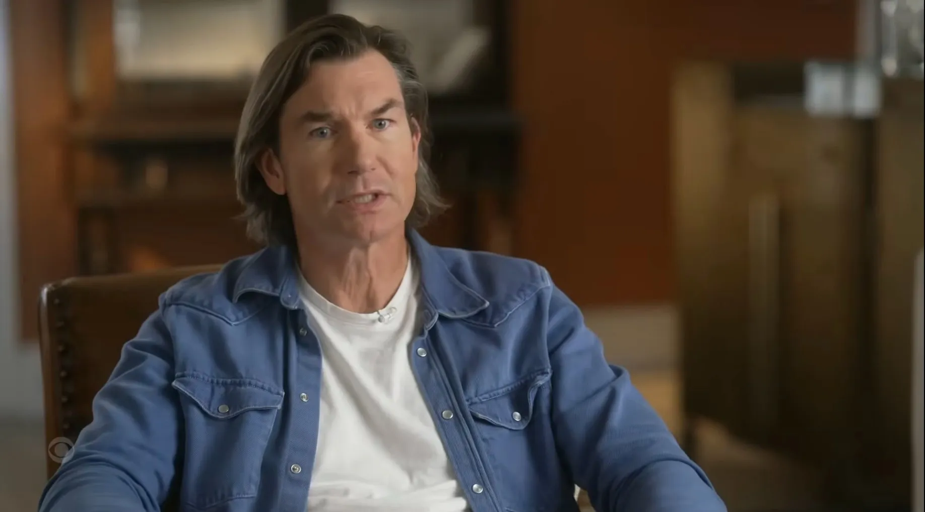 Jerry O'Connell in an interview, wearing a blue denim shirt over a white t-shirt.