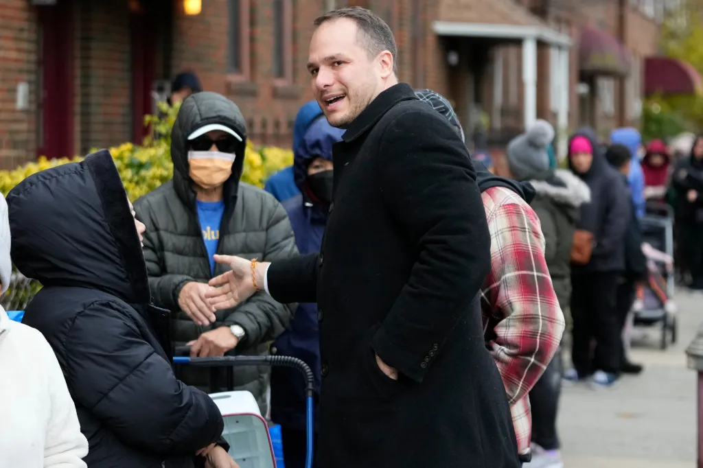 Jersey City mayoral candidate James Solomon greets people at a food drive.