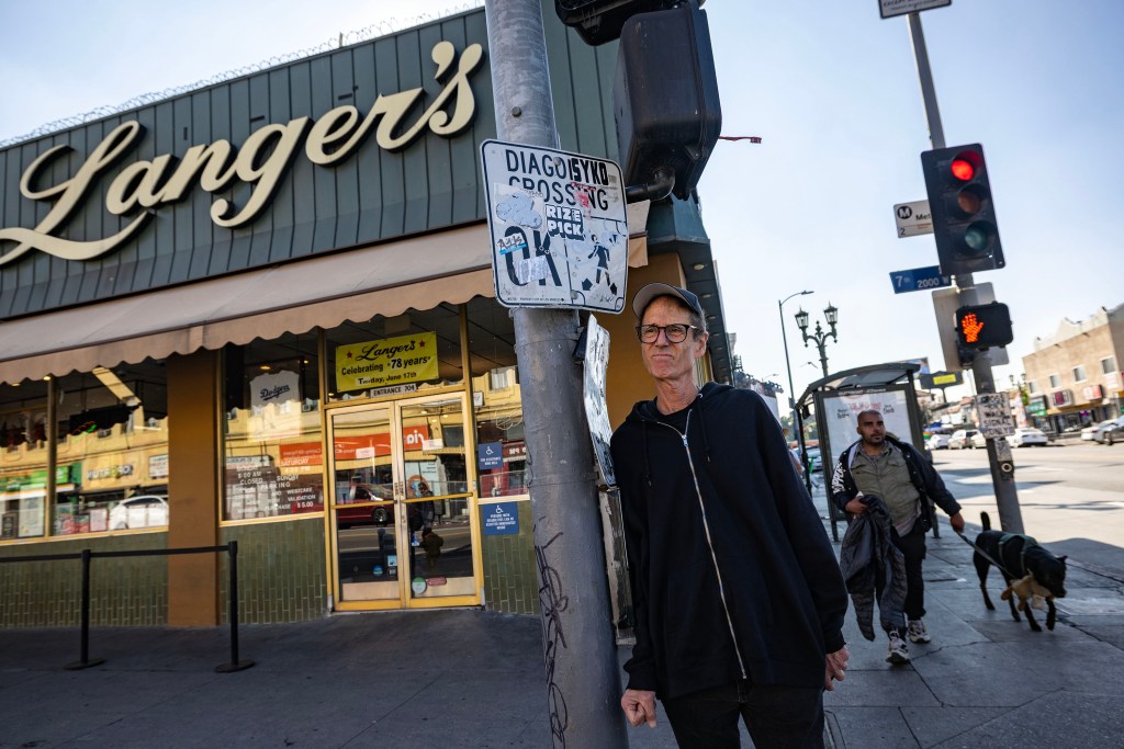 John Alle, owner of the building housing Langer's restaurant, stands across the street from MacArthur Park.