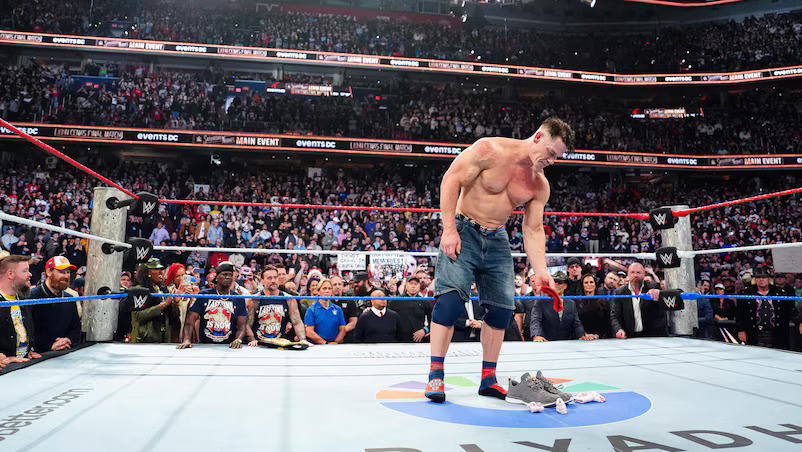 John Cena leaves his boots and wristbands in the ring