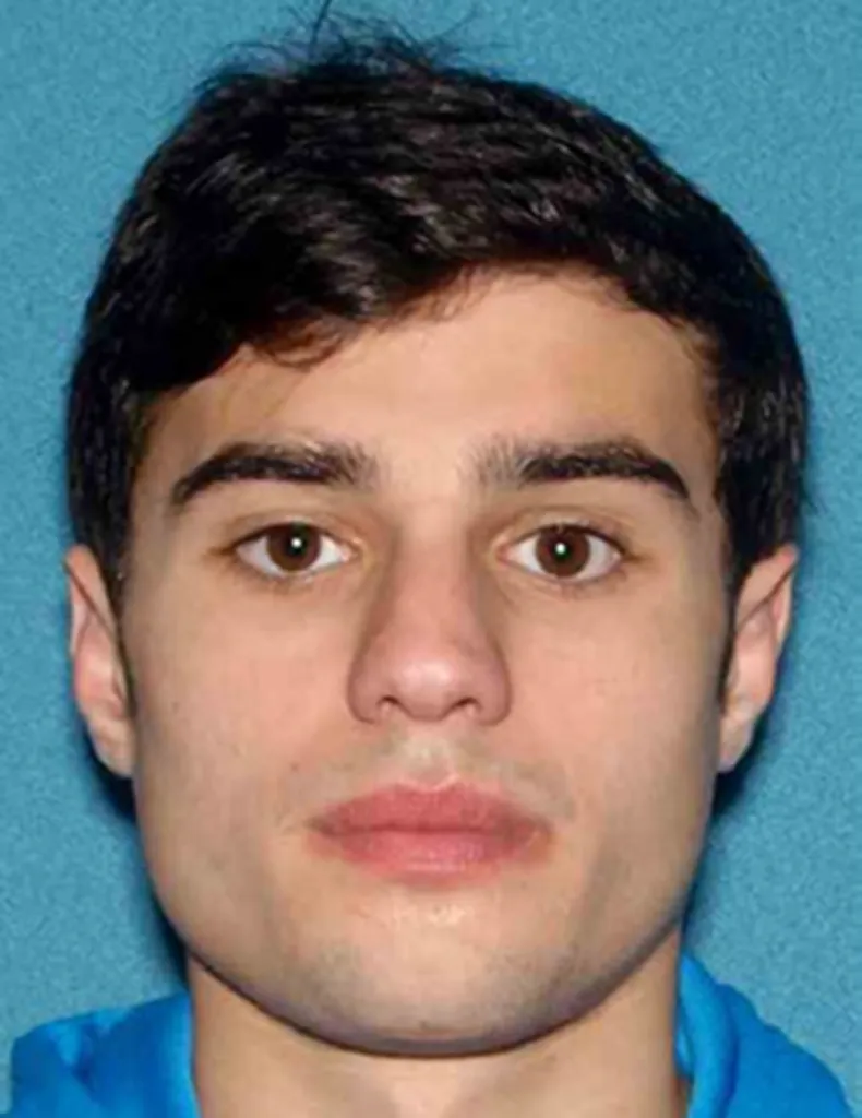 Headshot of Joseph R. Perna, a young man with dark hair and brown eyes, wearing a blue shirt.