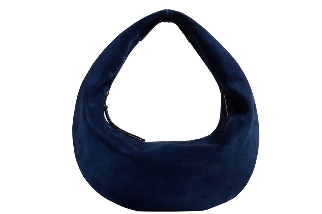Navy blue suede crescent shoulder bag with a gold zipper.