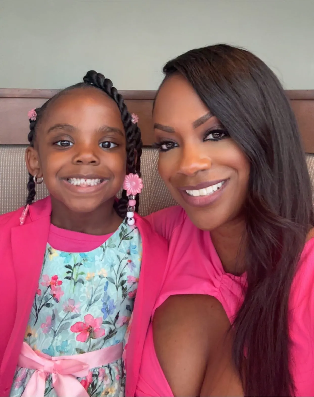 Kandi Burruss and her daughter, Blaze, smiling at the camera.