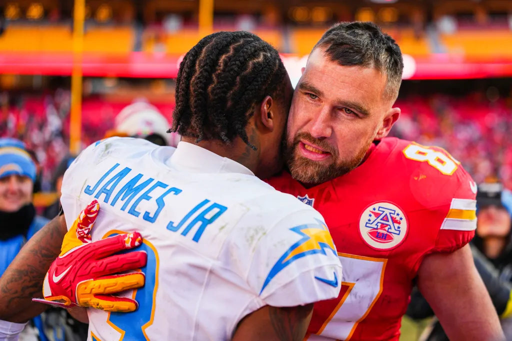 Kansas City Chiefs tight end Travis Kelce (87) talks with Los Angeles Chargers safety Derwin James Jr. (3) following a Chargers victory.
