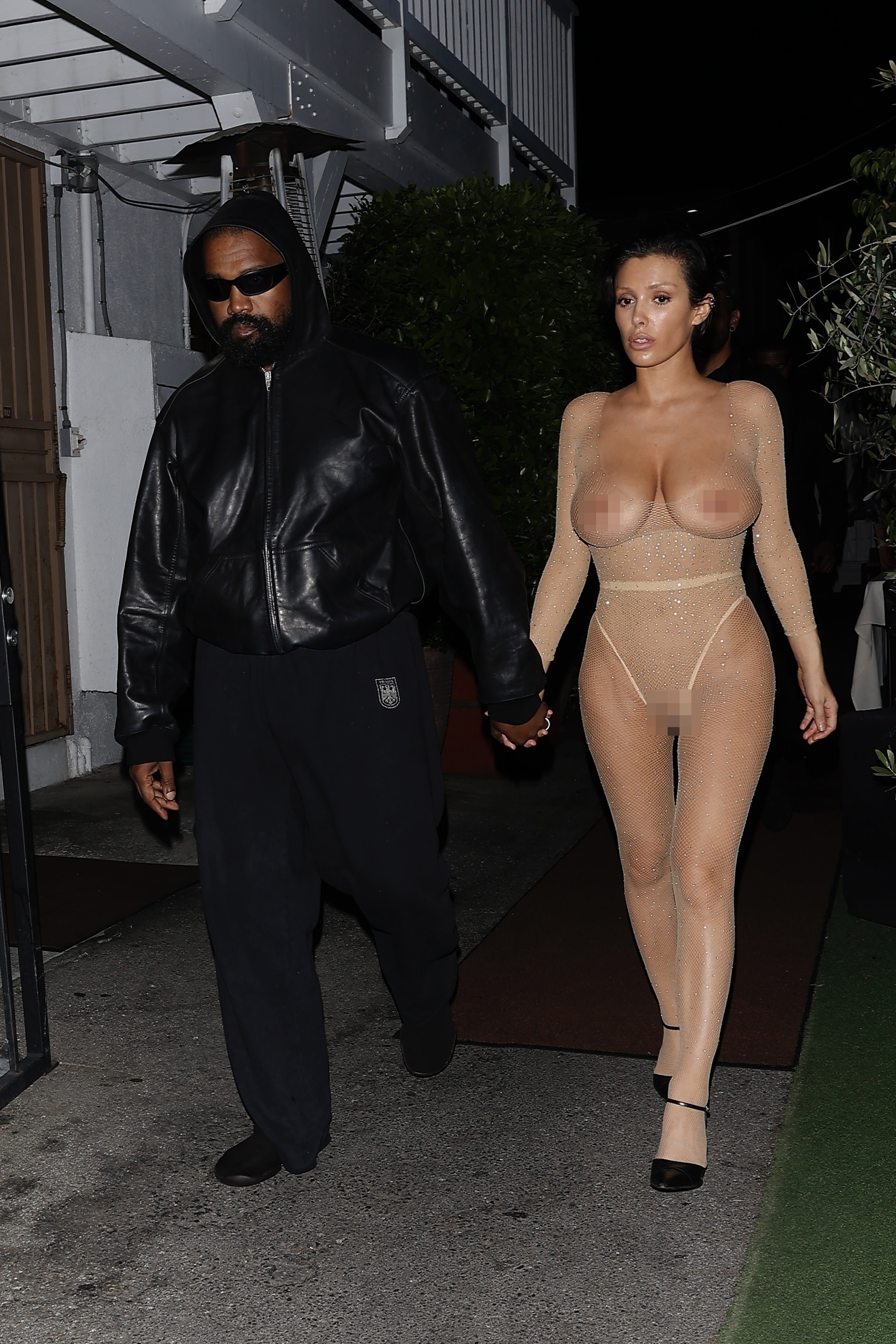 Kanye West and Bianca Censori arriving for a dinner party.
