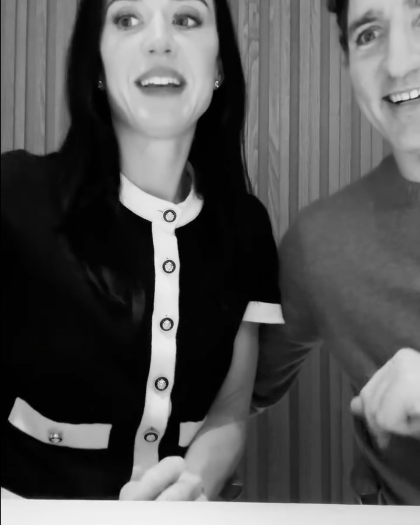 Katy Perry and Justin Trudeau smiling at the camera.