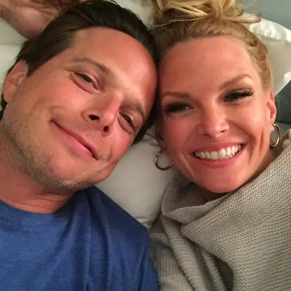Kelley and Scott Wolf smiling together.