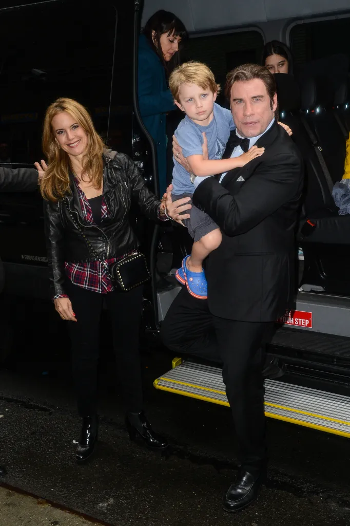 Kelly Preston, Benjamin Travolta, and John Travolta leaving a vehicle.
