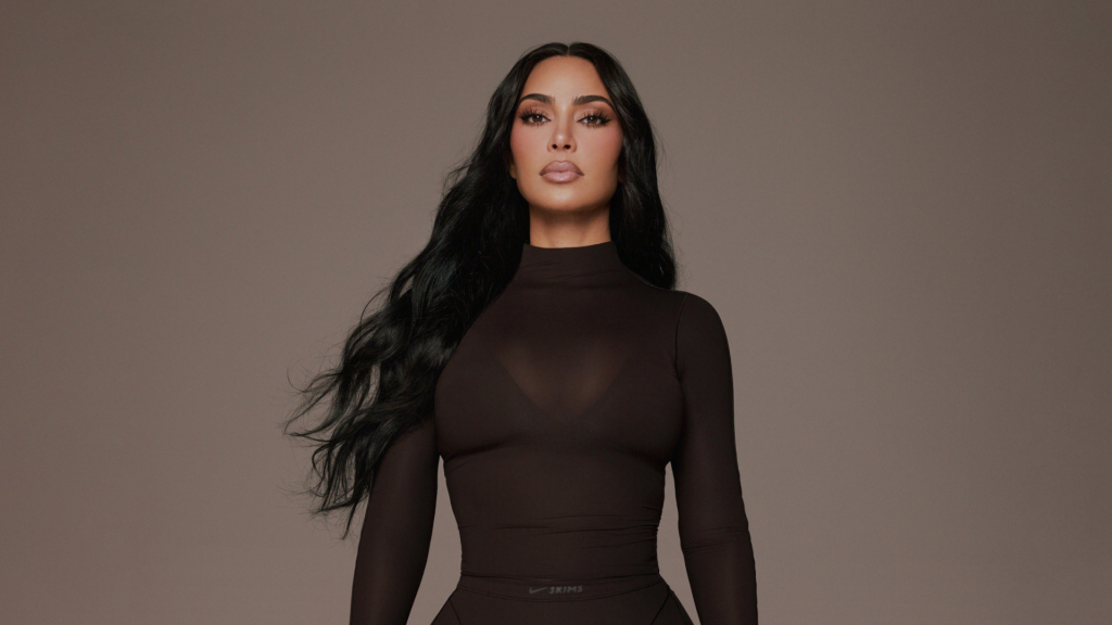 Kim Kardashian wearing a dark brown long-sleeved top for Masterclass.