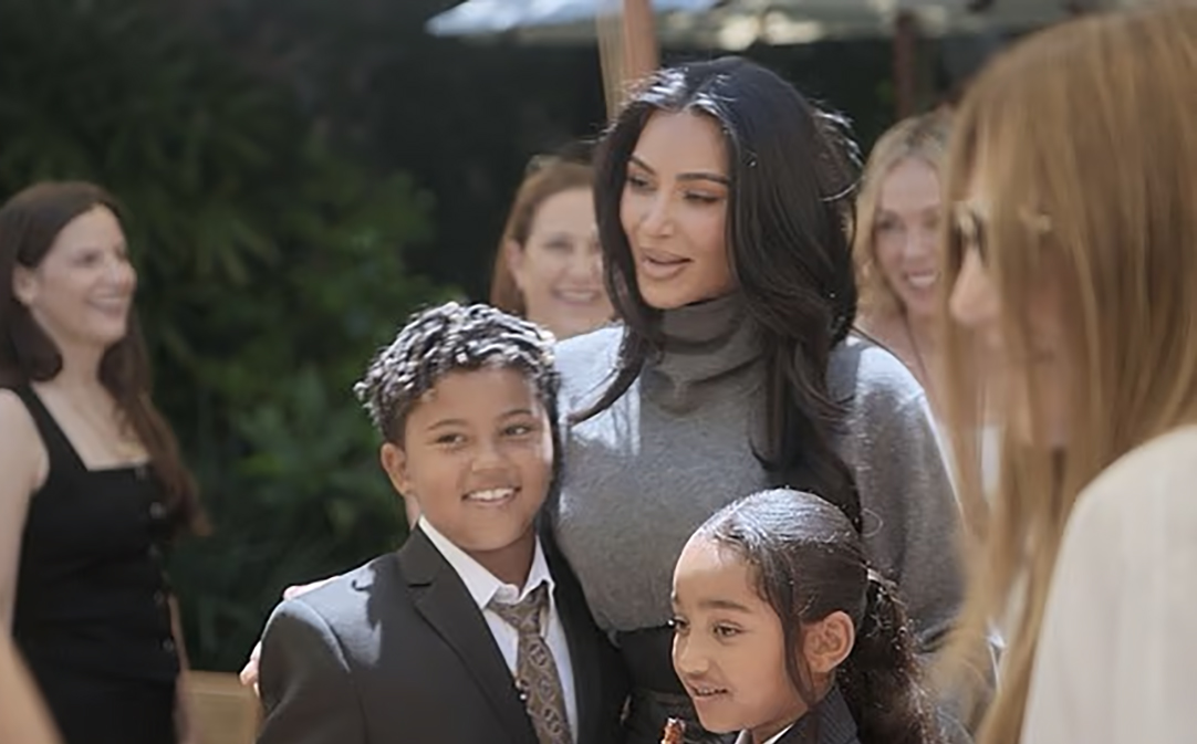Kim Kardashian with her two sons at her law school graduation party.