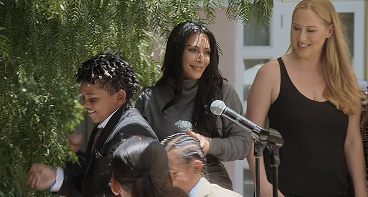 Kim Kardashian reacting to her sons fighting on stage at her law school graduation party.