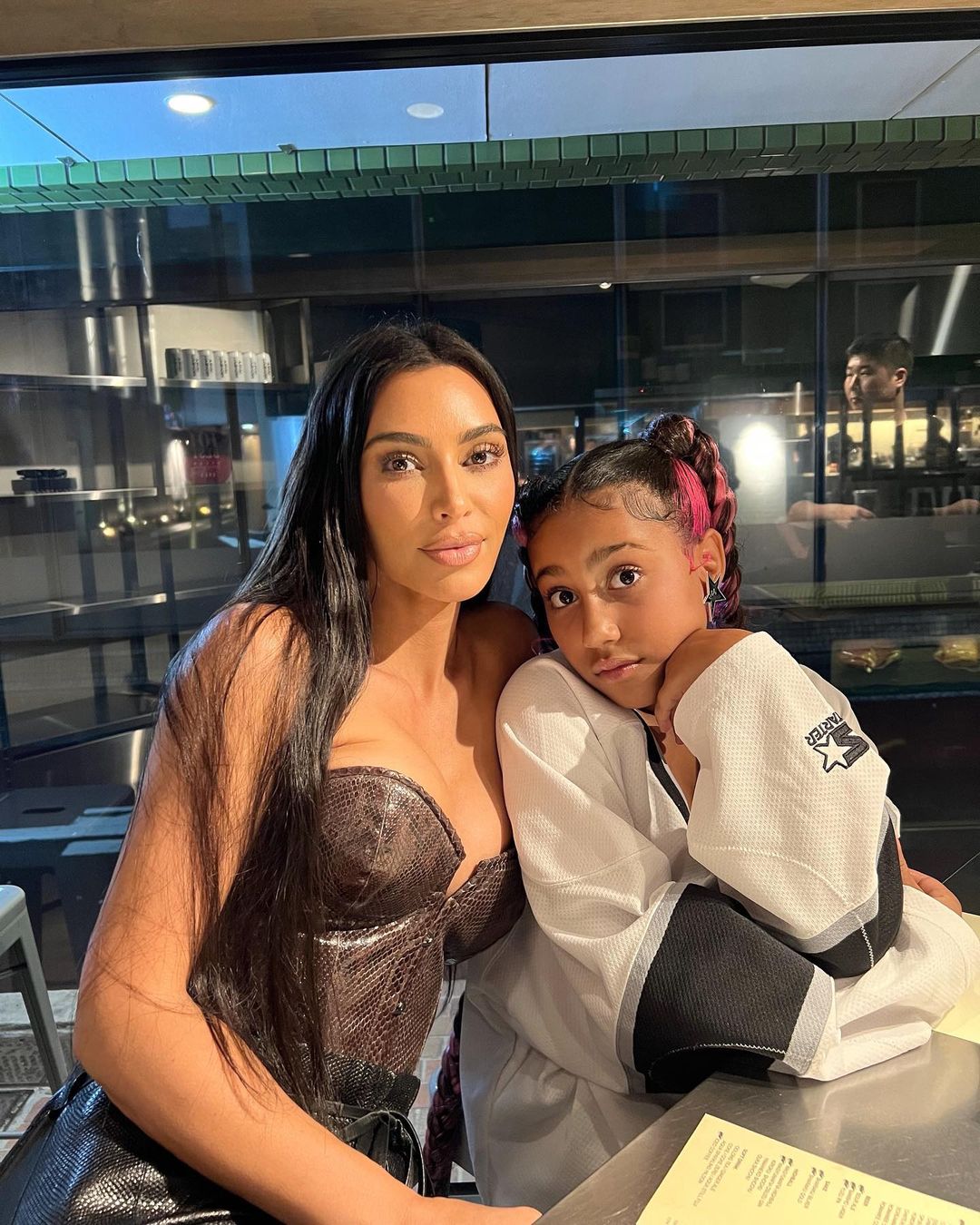 Kim Kardashian and North West pose for a photo.