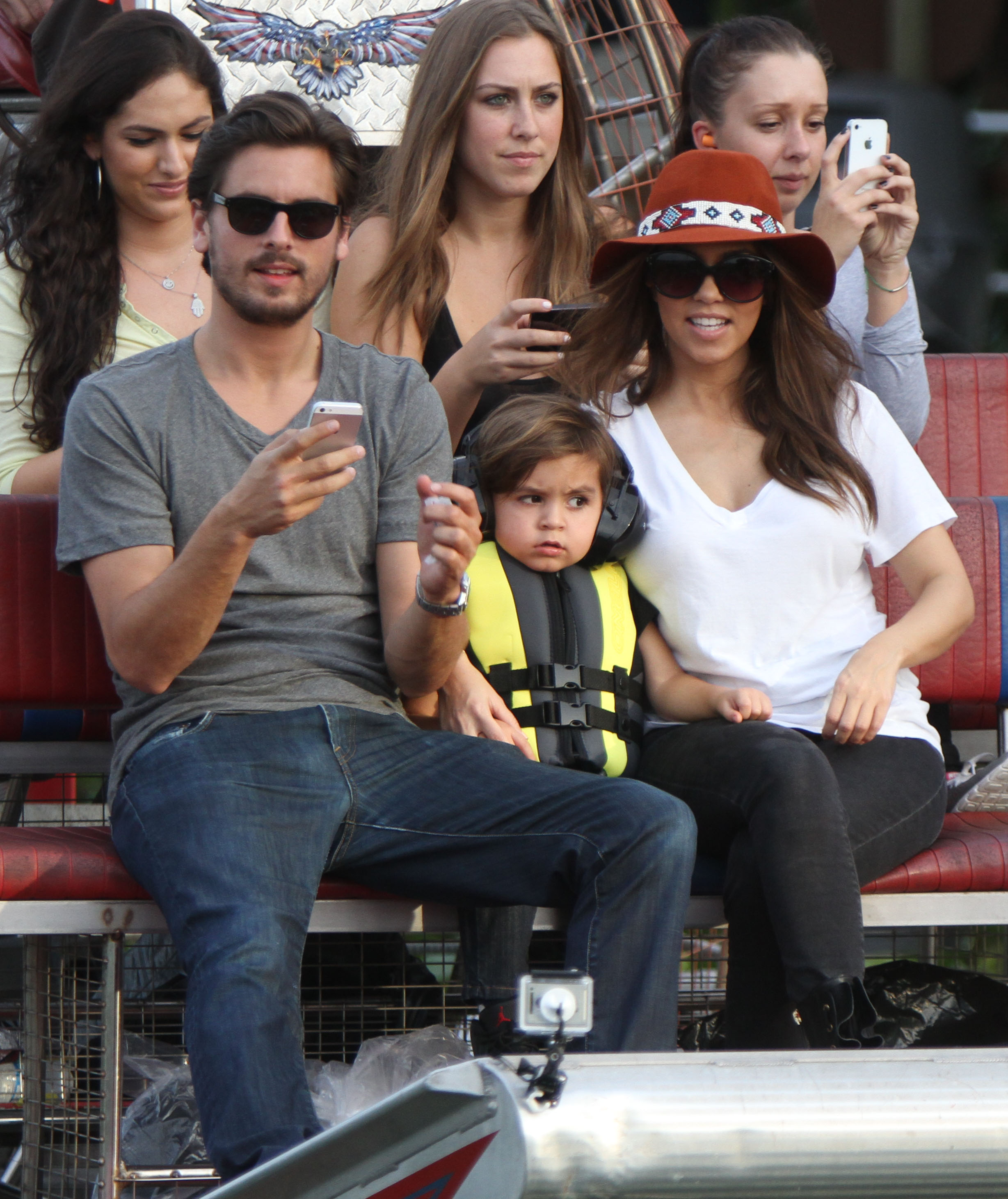 Scott Disick, son Mason, and partner Kourtney Kardashian enjoy an airboat ride in the everglades.