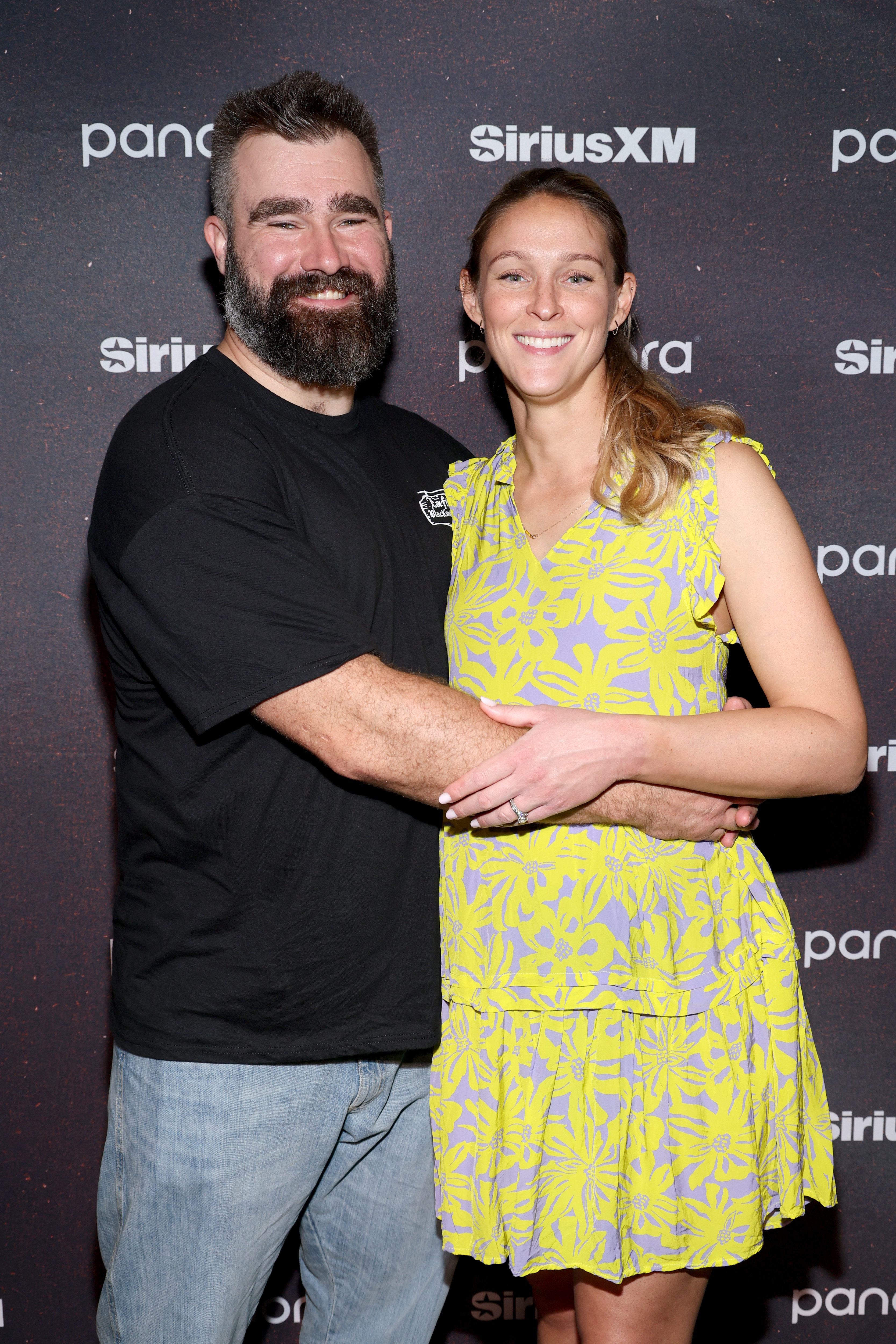 Jason Kelce and Kylie Kelce smiling at the camera.