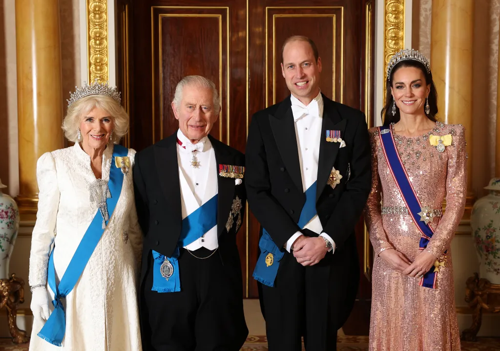 Queen Camilla, King Charles III, Prince William and Catherine, Princess of Wales in a photo at Buckingham Palace on Dec. 5, 2023. 
