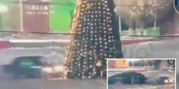 Joyride ends in disaster as driver smashes into towering Christmas tree in Kazakhstan – and is ordered to fix it
